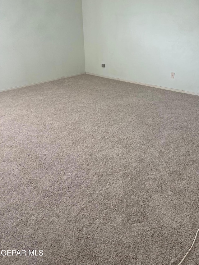 6609 El Poste Ct, El Paso, TX 79912 - spare room featuring carpet floors and baseboards