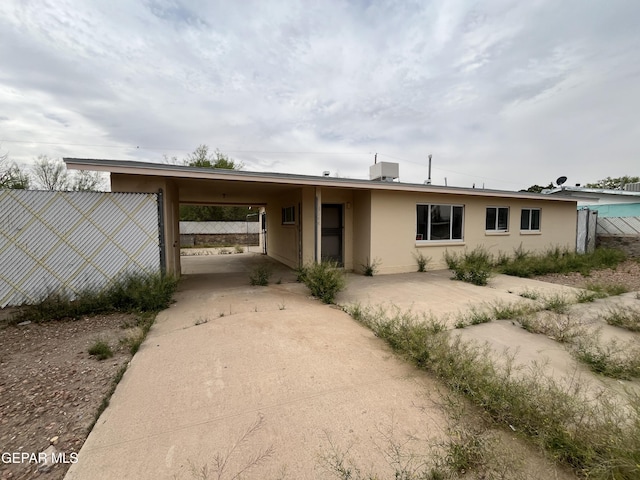 8244 Strickland Dr, El Paso, TX 79907 - view of front of house featuring a carport, concrete driveway, and stucco siding