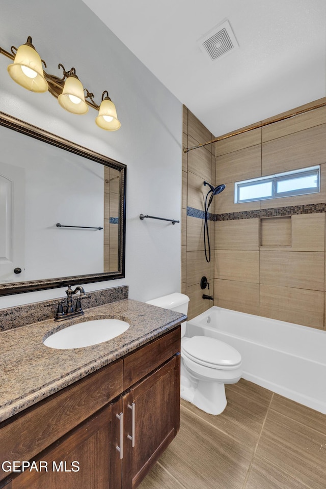 3199 Red Maple Dr, El Paso, TX 79938 - bathroom featuring vanity,  shower combination, and toilet