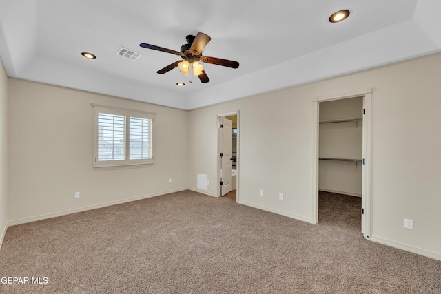 3199 Red Maple Dr, El Paso, TX 79938 - unfurnished bedroom with carpet, a spacious closet, recessed lighting, baseboards, and a raised ceiling