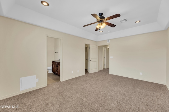 3199 Red Maple Dr, El Paso, TX 79938 - unfurnished bedroom featuring carpet, recessed lighting, baseboards, a raised ceiling, and connected bathroom