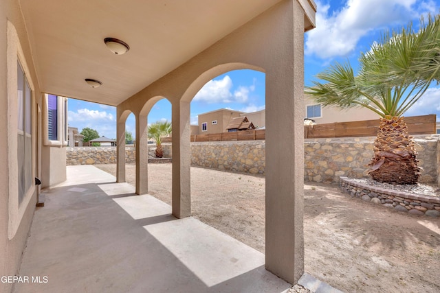3199 Red Maple Dr, El Paso, TX 79938 - fenced backyard with a patio area