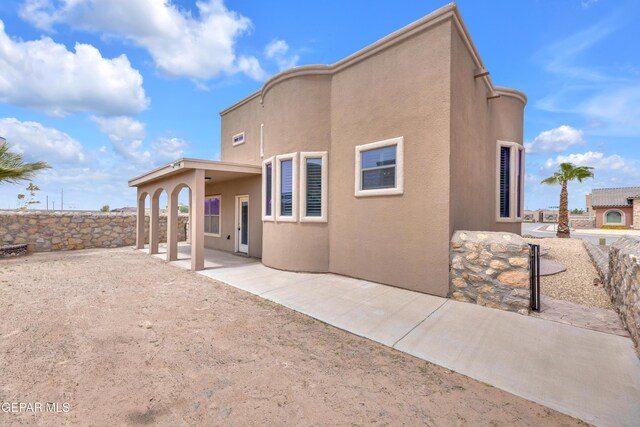 3199 Red Maple Dr, El Paso, TX 79938 - rear view of house with a patio and stucco siding