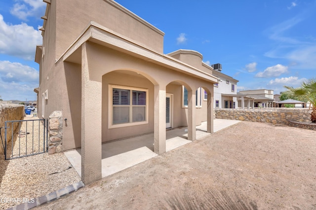 3199 Red Maple Dr, El Paso, TX 79938 - view of property exterior featuring stucco siding and a patio area