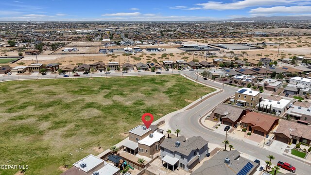 3199 Red Maple Dr, El Paso, TX 79938 - aerial overview of property's location with nearby suburban area and a mountainous background