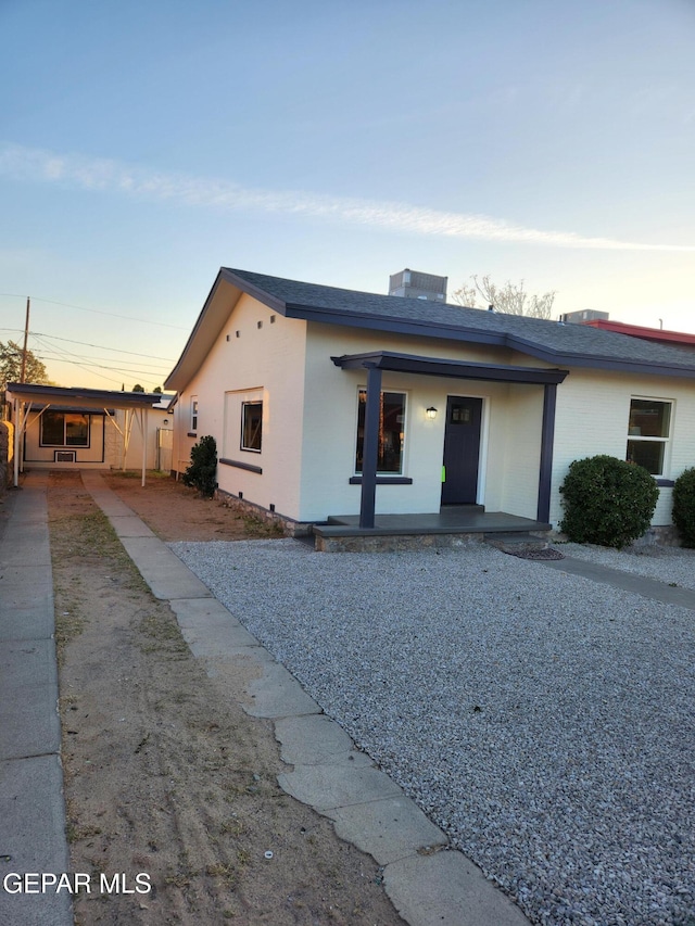 4122 Cumberland Ave, El Paso, TX 79903 - view of front facade with a porch, driveway, and a shingled roof