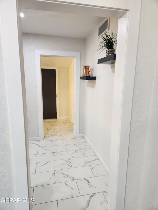 4122 Cumberland Ave, El Paso, TX 79903 - hallway with light marble finish floors and baseboards