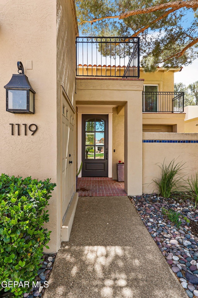 1119 Los Jardines Cir, El Paso, TX 79912 - property entrance featuring stucco siding and a balcony