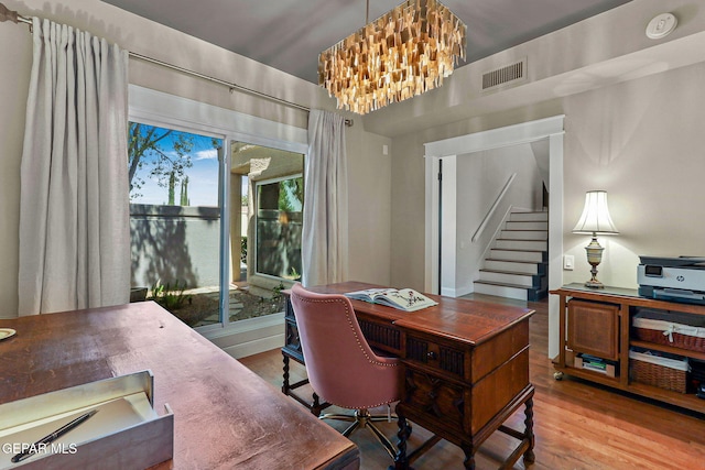 1119 Los Jardines Cir, El Paso, TX 79912 - office area featuring a chandelier and wood finished floors