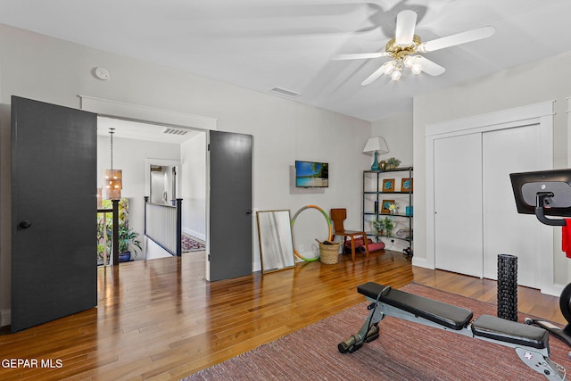 1119 Los Jardines Cir, El Paso, TX 79912 - exercise room with wood finished floors and a ceiling fan