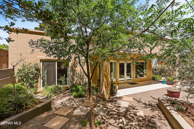 1119 Los Jardines Cir, El Paso, TX 79912 - rear view of property featuring french doors and stucco siding