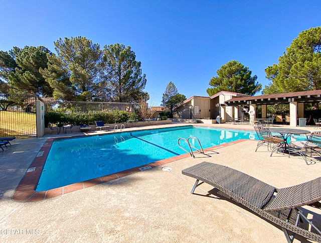 1119 Los Jardines Cir, El Paso, TX 79912 - community pool with a patio area and a pergola