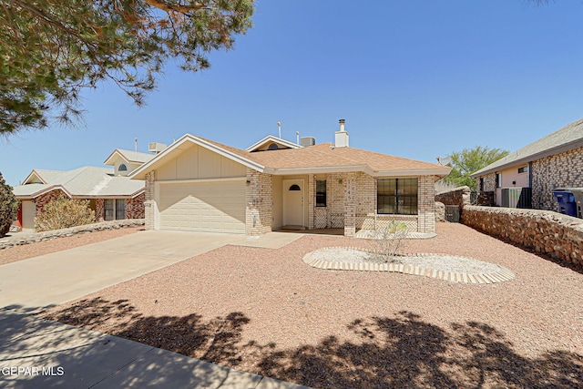 7145 Golden Hawk Dr, El Paso, TX 79912 - ranch-style home with brick siding, a garage, driveway, covered porch, and a shingled roof