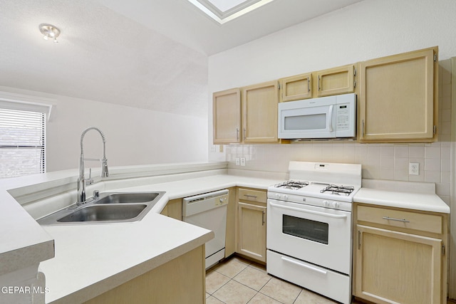 7145 Golden Hawk Dr, El Paso, TX 79912 - kitchen with white appliances, light brown cabinets, a sink, backsplash, and light countertops