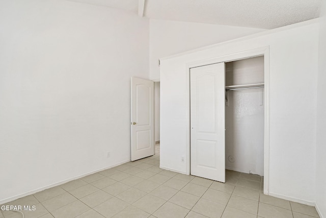 7145 Golden Hawk Dr, El Paso, TX 79912 - unfurnished bedroom with light tile patterned floors, a closet, and baseboards