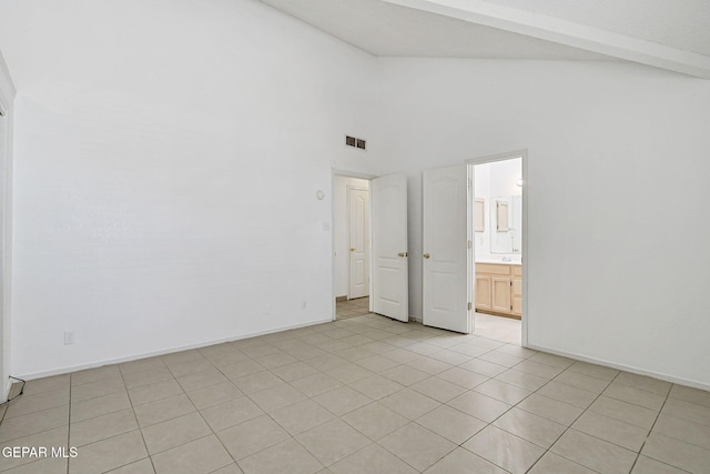 7145 Golden Hawk Dr, El Paso, TX 79912 - spare room with high vaulted ceiling, beamed ceiling, light tile patterned flooring, and baseboards