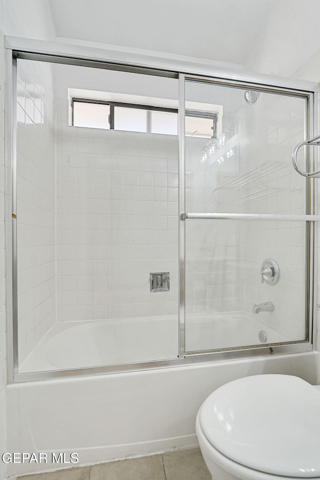 7145 Golden Hawk Dr, El Paso, TX 79912 - bathroom with tile patterned flooring, toilet, and combined bath / shower with glass door