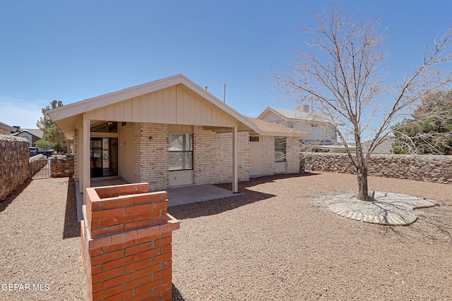 7145 Golden Hawk Dr, El Paso, TX 79912 - back of house featuring brick siding