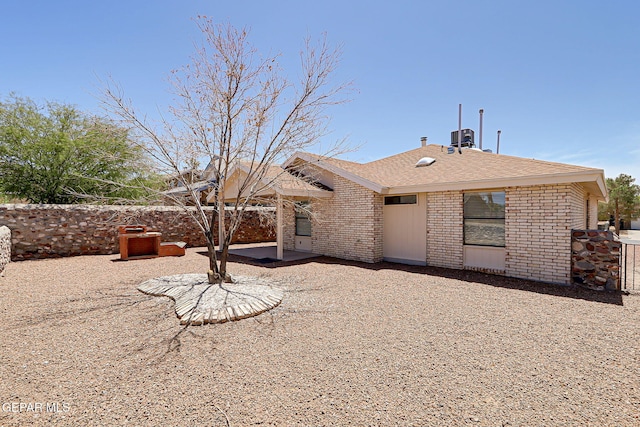 7145 Golden Hawk Dr, El Paso, TX 79912 - back of house with a patio area, brick siding, and roof with shingles