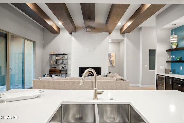 2212 Mike Price Dr, El Paso, TX 79938 - kitchen with beverage cooler, light countertops, open floor plan, and open shelves