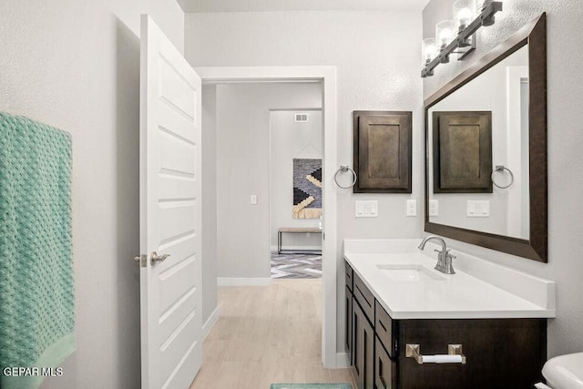 2212 Mike Price Dr, El Paso, TX 79938 - bathroom with vanity and wood finished floors
