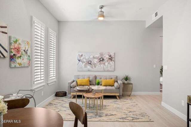 2212 Mike Price Dr, El Paso, TX 79938 - living room featuring healthy amount of natural light, wood finished floors, and a ceiling fan