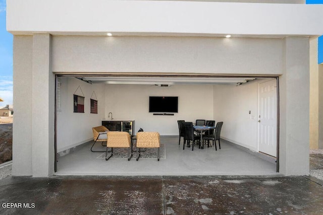 2212 Mike Price Dr, El Paso, TX 79938 - view of patio / terrace featuring outdoor dining space and a garage