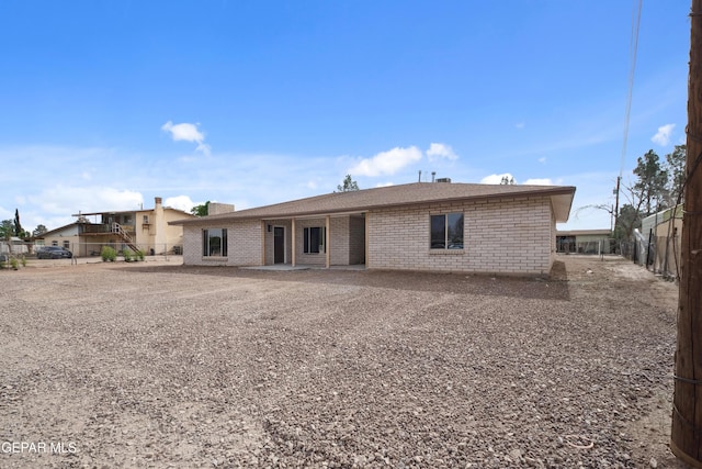 10950 Jo Way, Socorro, TX 79927 - rear view of house with brick siding