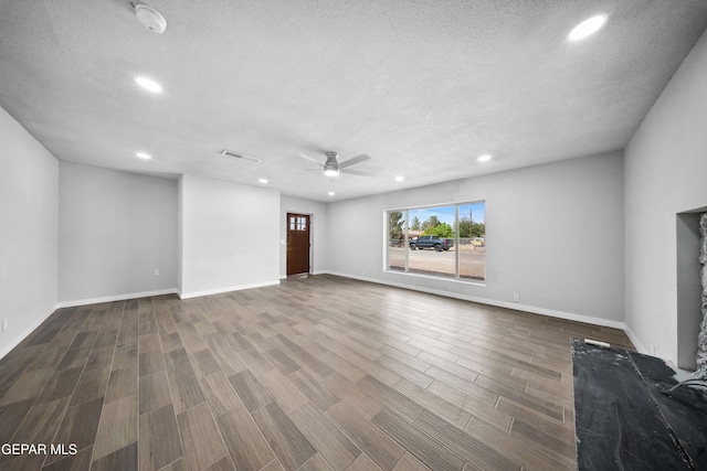 10950 Jo Way, Socorro, TX 79927 - unfurnished living room featuring recessed lighting, a ceiling fan, a textured ceiling, wood finished floors, and baseboards