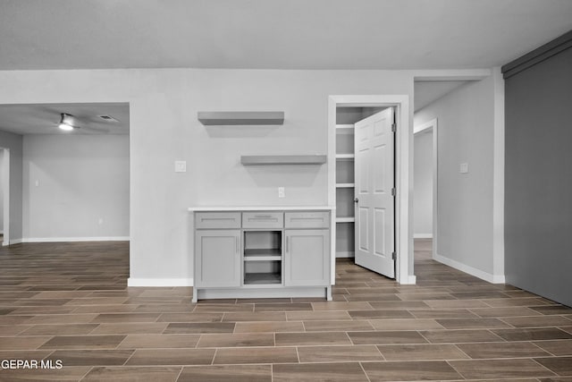 10950 Jo Way, Socorro, TX 79927 - unfurnished living room featuring dark wood-style floors and baseboards