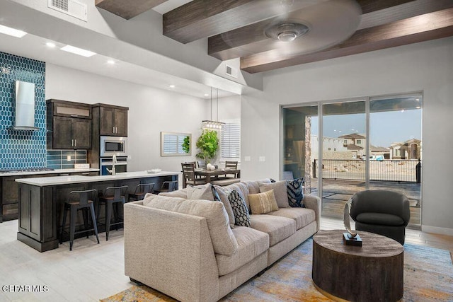 2228 Mike Price Dr, El Paso, TX 79938 - living area with light wood-style floors, beamed ceiling, recessed lighting, and ceiling fan