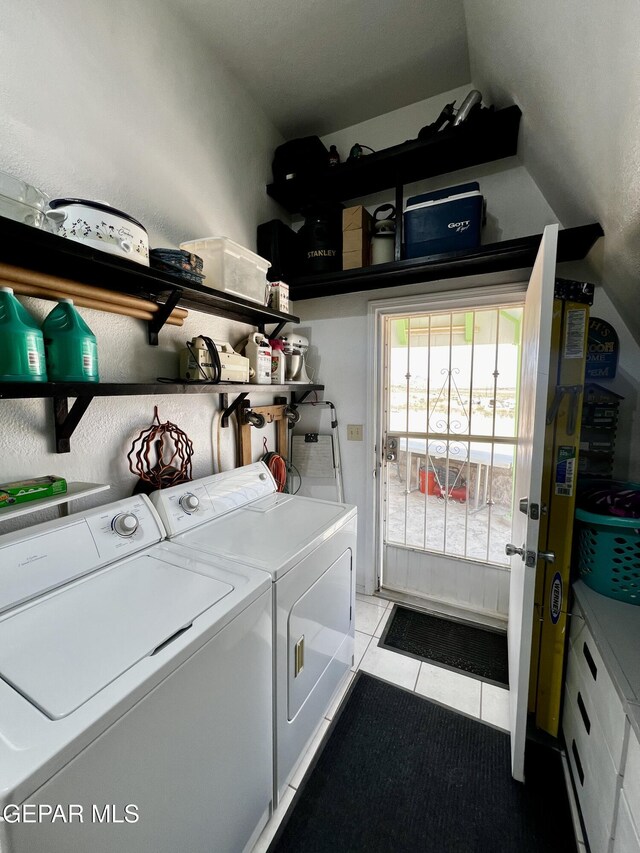 16899 Old Butterfield Trl, El Paso, TX 79938 - laundry area featuring washer and dryer and light tile patterned floors