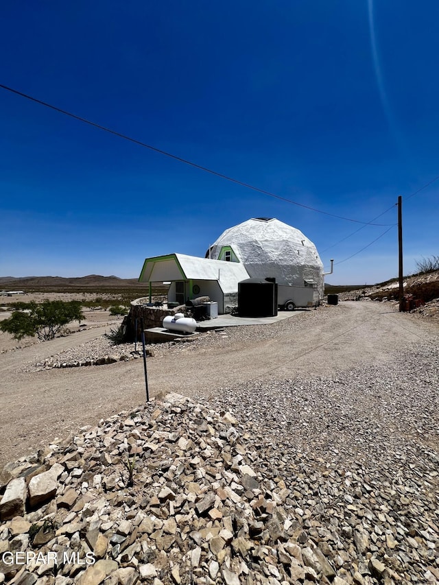 16899 Old Butterfield Trl, El Paso, TX 79938 - view of yard with driveway and a mountain view