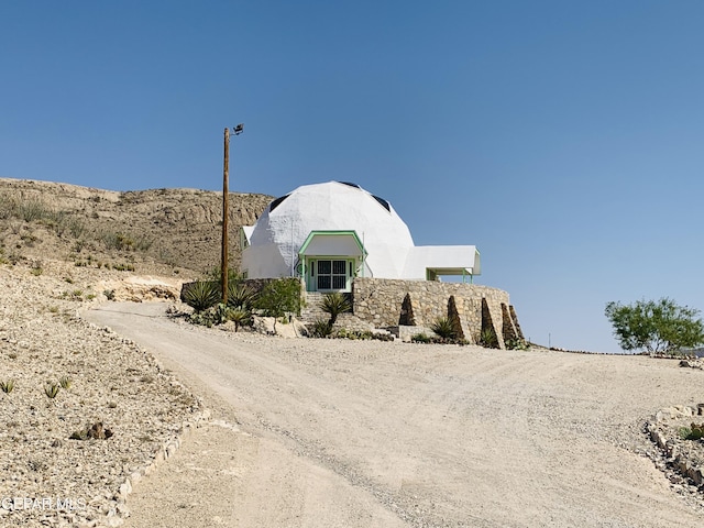 16899 Old Butterfield Trl, El Paso, TX 79938 - view of front of home featuring stucco siding and driveway