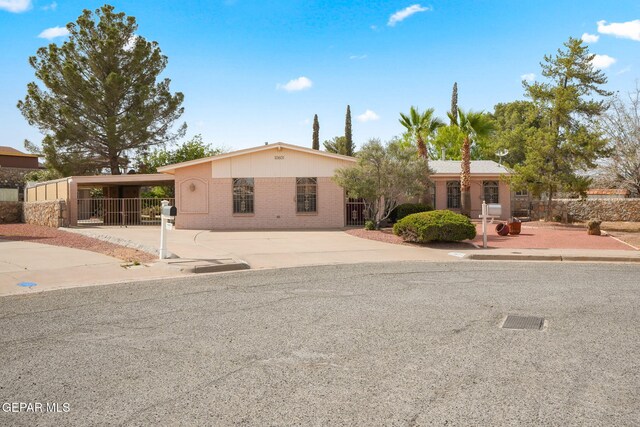 10601 Groverock Ct, El Paso, TX 79935 - view of front of house with brick siding and driveway