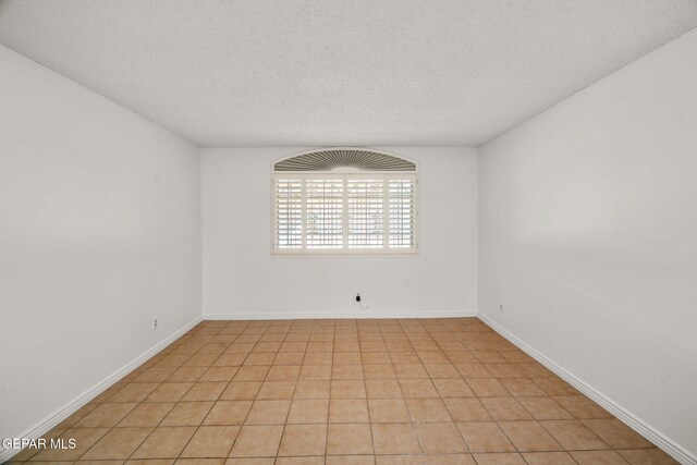 10601 Groverock Ct, El Paso, TX 79935 - unfurnished room with a textured ceiling