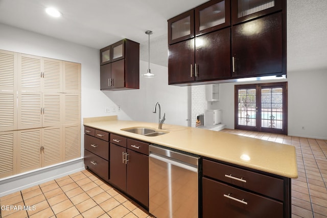10601 Groverock Ct, El Paso, TX 79935 - kitchen featuring dishwasher, a sink, light tile patterned flooring, and light countertops