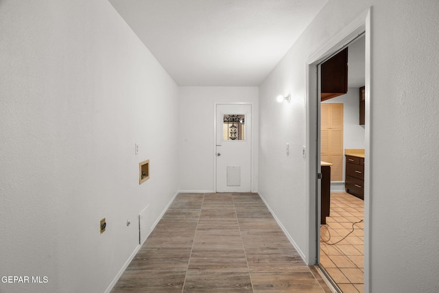 10601 Groverock Ct, El Paso, TX 79935 - corridor featuring baseboards and wood finished floors