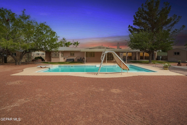 10601 Groverock Ct, El Paso, TX 79935 - swimming pool with a patio, a water slide, and a diving board