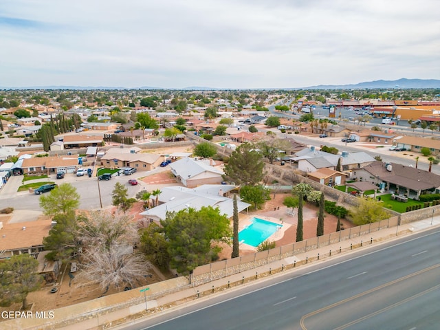 10601 Groverock Ct, El Paso, TX 79935 - aerial view of residential area with a pool area and a mountainous background