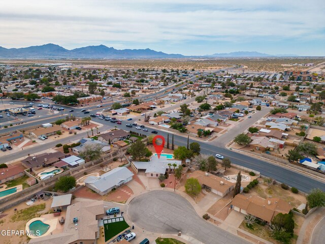 10601 Groverock Ct, El Paso, TX 79935 - aerial view of property and surrounding area with mountains and nearby suburban area