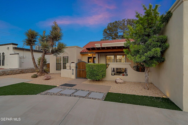 840 Tepic Dr, El Paso, TX 79912 - mediterranean / spanish home with a gate, stucco siding, and a tile roof