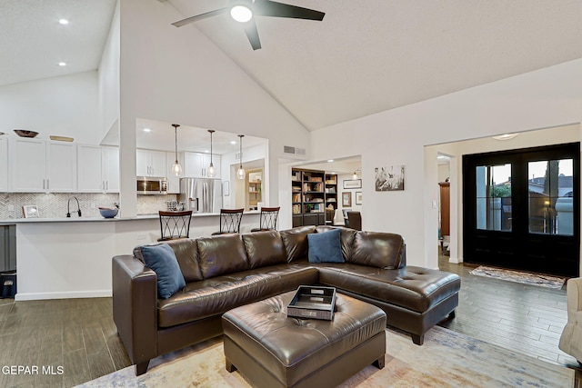 840 Tepic Dr, El Paso, TX 79912 - living room featuring light wood-style floors, high vaulted ceiling, and a ceiling fan