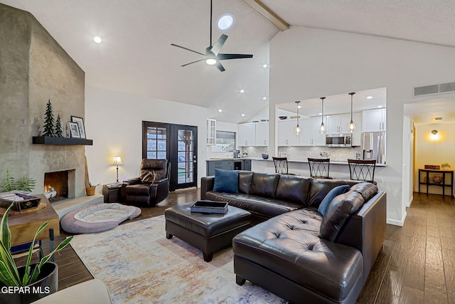 840 Tepic Dr, El Paso, TX 79912 - living area featuring high vaulted ceiling, a ceiling fan, dark wood-style flooring, a fireplace, and beam ceiling