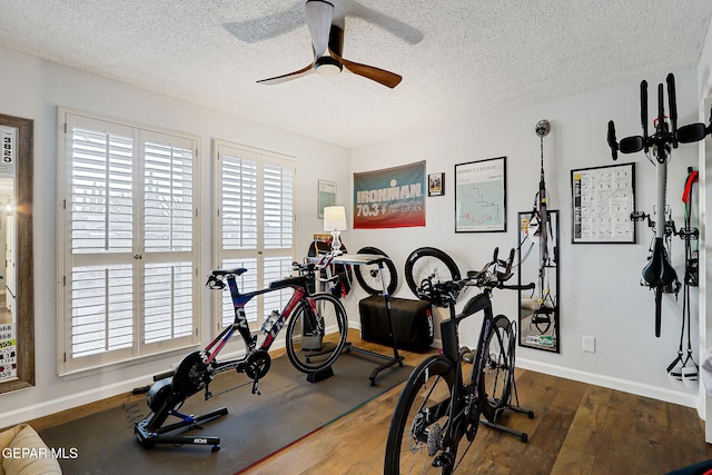 840 Tepic Dr, El Paso, TX 79912 - exercise area featuring a ceiling fan, a textured ceiling, hardwood / wood-style flooring, and baseboards