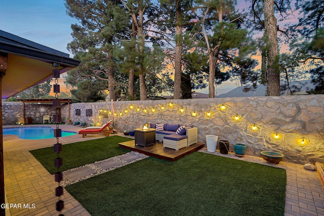 840 Tepic Dr, El Paso, TX 79912 - yard at dusk featuring a patio and an outdoor living space with a fire pit