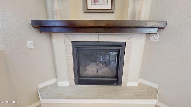 5712 Valley Lilac Ln, El Paso, TX 79932 - detailed view of baseboards and a fireplace