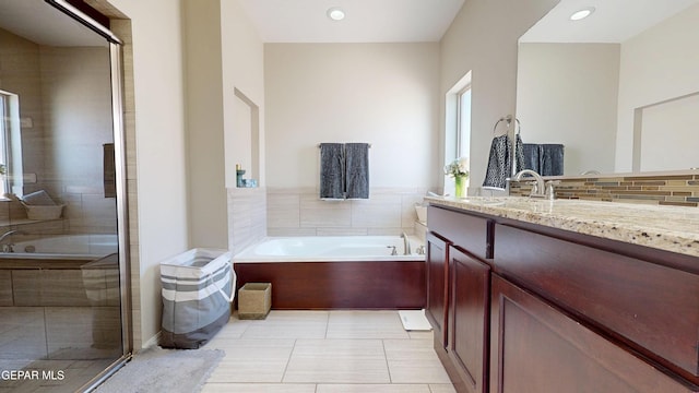 5712 Valley Lilac Ln, El Paso, TX 79932 - bathroom featuring vanity, a bath, tile patterned floors, recessed lighting, and a shower with shower door
