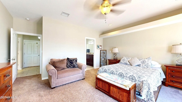 5712 Valley Lilac Ln, El Paso, TX 79932 - bedroom featuring light carpet, a ceiling fan, and ensuite bath