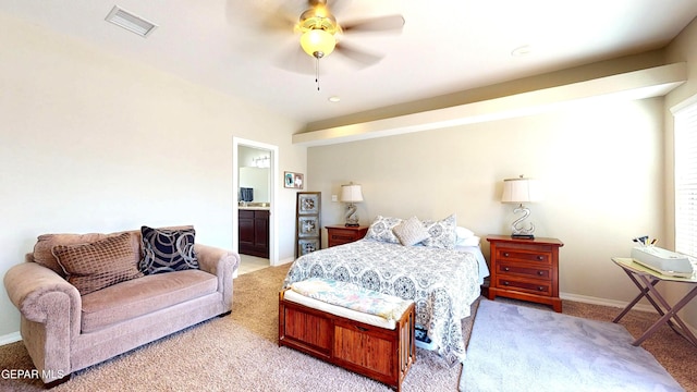 5712 Valley Lilac Ln, El Paso, TX 79932 - bedroom with light carpet, baseboards, a ceiling fan, and ensuite bath